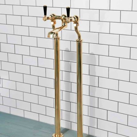 Linton Floor Mounted Bath Filler Tap With Black Levers in Polished Brass