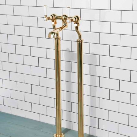 Linton Floor Mounted Bath Filler With White Levers In Living Brass