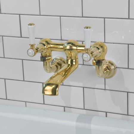 Linton Bath Filler Tap Wall Mounted White Lever Timeless Brass 3/4BSP