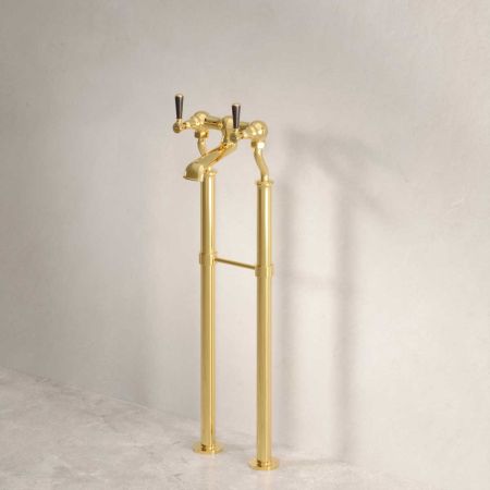 Linton Floor Mounted Bath Filler Tap With Black Levers in Living Brass
