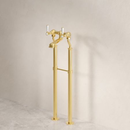 Linton Floor Mounted Bath Filler With White Levers In Living Brass