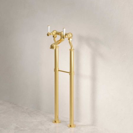 Linton Floor Mounted Bath Filler With White Levers In Living Brass