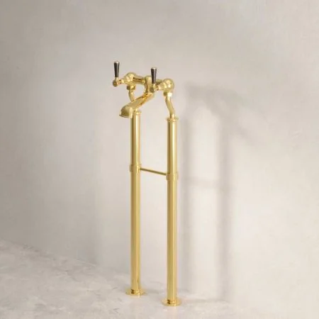 Linton Floor Mounted Bath Filler Tap With Black Levers in Living Brass