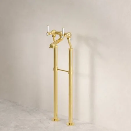 Linton Classic Floor Mounted Bath Filler With White Levers In Living Brass