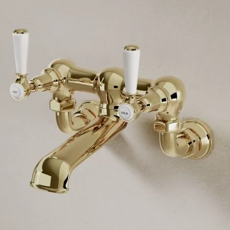 Linton Classic Wall Mounted Bath Filler with White Levers in Timeless Brass